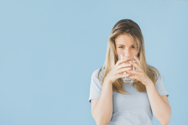 Girl drinking water.