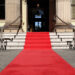 a red carpet leading to a building