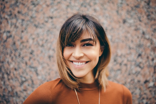 Woman smiling at the camera.