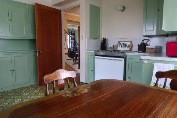 kitchen with green cabinets from twilight.