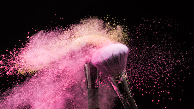 pink powder makeup on brushes. 