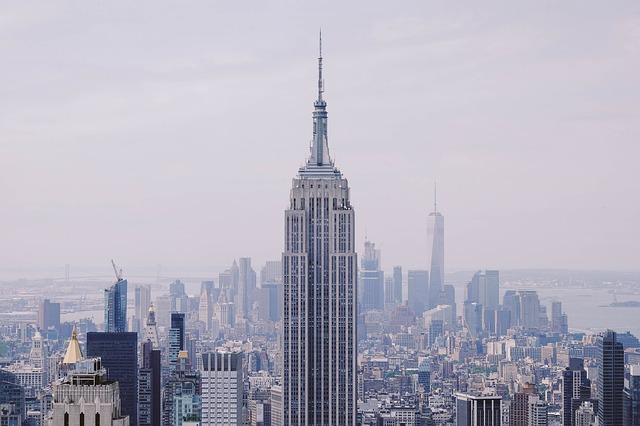 Empire state building surrounded by air pollution and smog. 