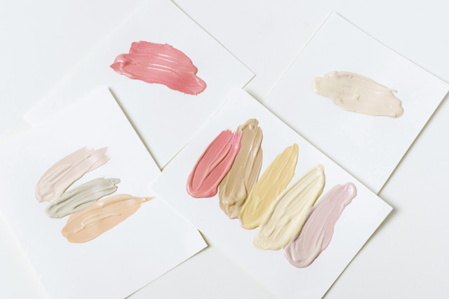 swatches of different colors of concealer. 