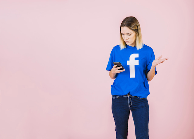 woman wearing a Facebook shirt, confused by soft ghosting message. 