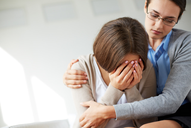 woman crying from stress at work.